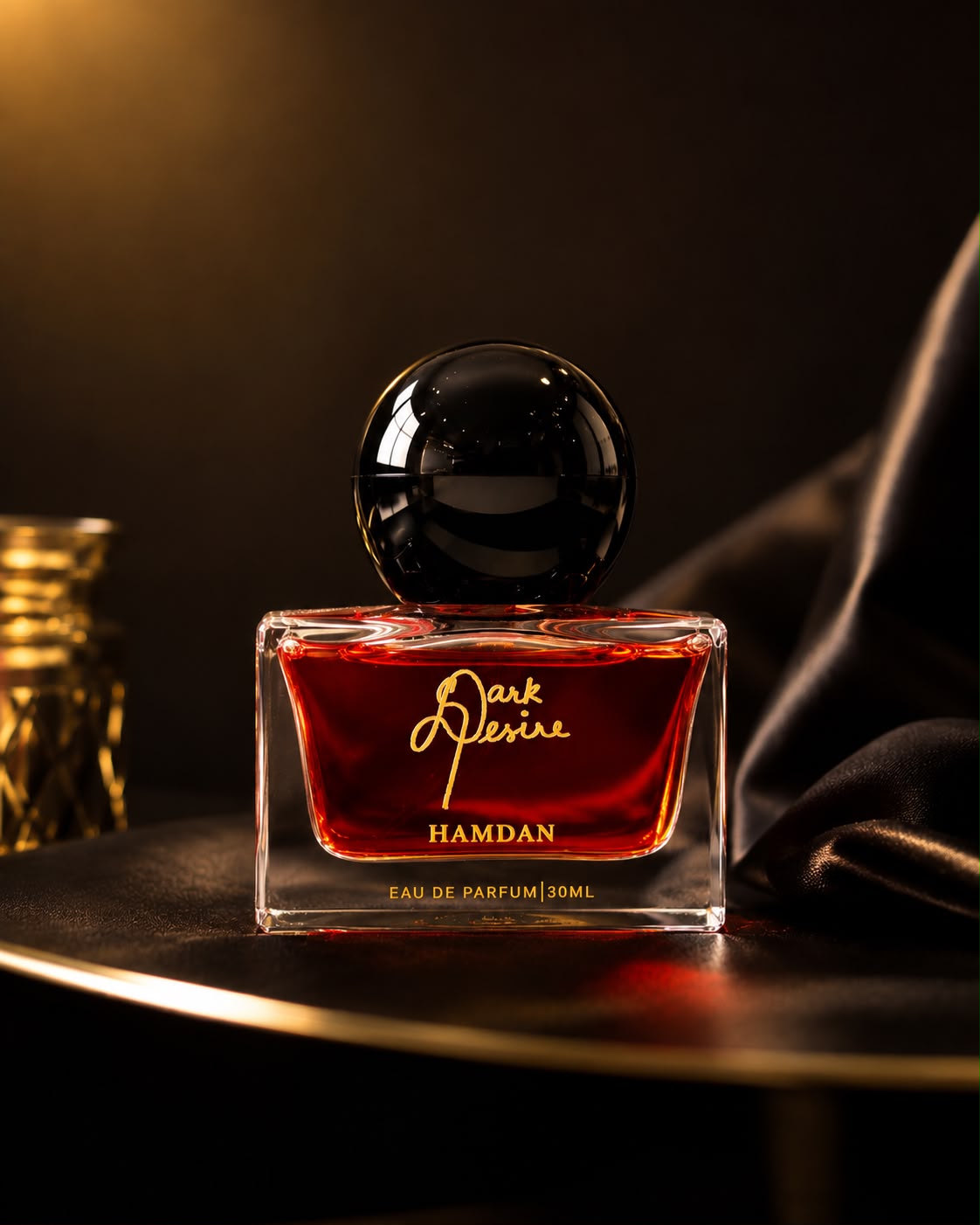 A HAMDAN eau de parfum bottle in warm candlelight